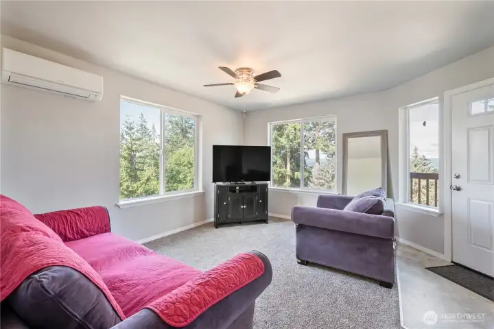 Great living room with lots of natural light and views from every window.