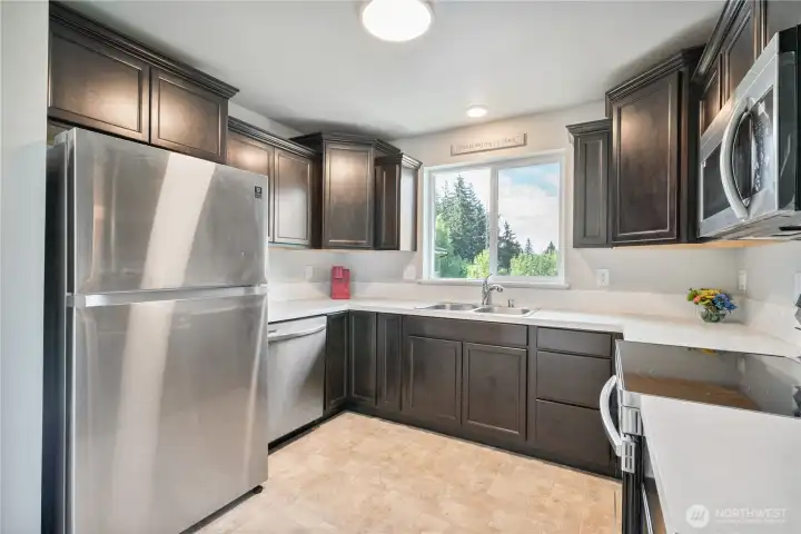 Very functional kitchen with lots of cabinet and counter space.