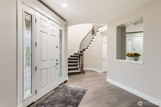 Step inside to discover beautiful finishes. Off the entry is an elegant staircase to the upper level.