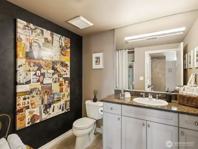 Main bathroom complete with shower stall for stay over guests.