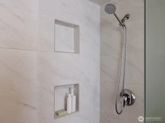 Spa like shower with porcelain tile & two niche for your personal items!
