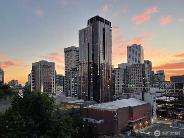 Evening view from the unit showing the gorgeous sunset & twinkling of the city lights!