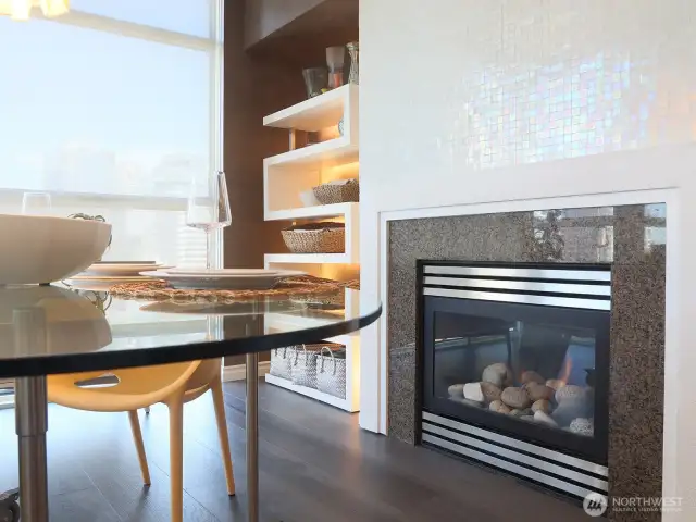 Enjoy a nice dinner right next to the beautifully refinished in Ann Sacks Opalescent Mosaic Tumbled Tile gas fireplace.