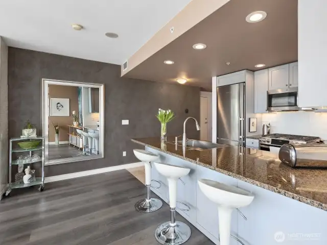 In the distance is a Roman Clay feature wall adding texture and warmth to this stunning home!