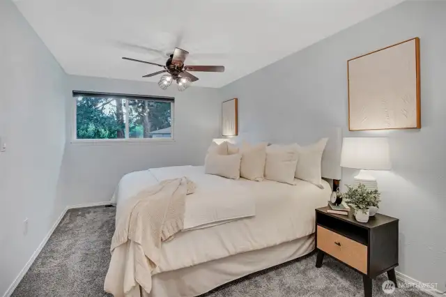 The primary bedroom continues with a neutral palette sure to go with any decor.