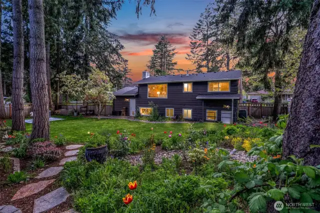 Exquisite landscaping surrounding the home will take your breath away.
