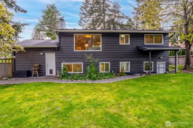 Back view of home. Don't miss the covered access door from the lower level.