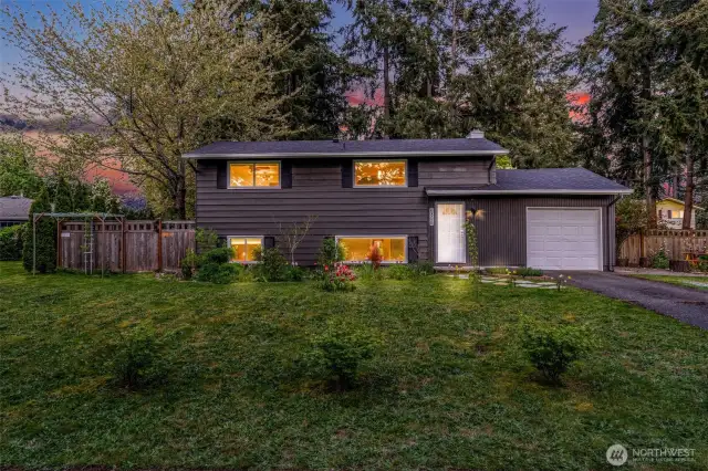 This darling home sits on a gorgeous lot surrounded by mature trees.
