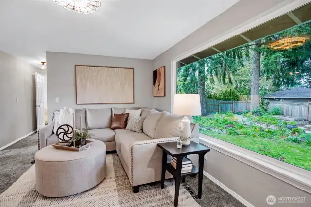 Enjoy the lush green backdrop from the large picture window.