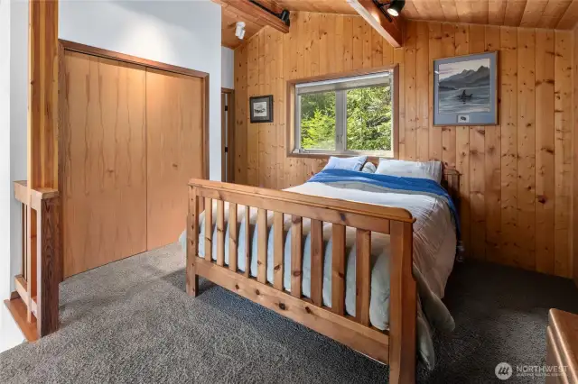 Loft Primary Suite! Large closet has lovely live edge shelving.