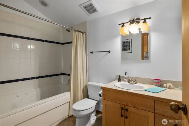 Primary Suite Loft! Jetted tub with tile surround.