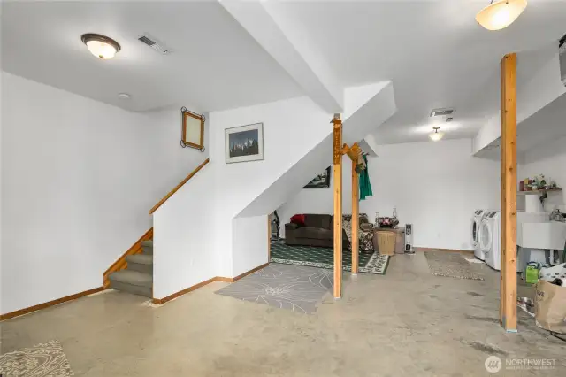 Rec room with laundry room & plenty of space for storage too!