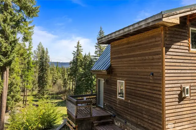Side of home showing small deck