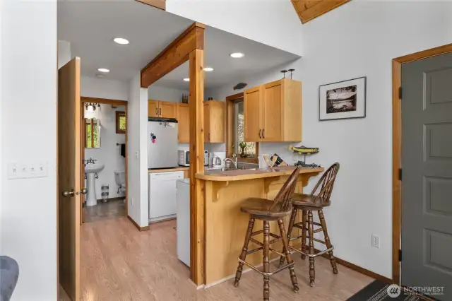 Cute island seating for 2! This door in the photo goes out to the side trex deck/additional access.