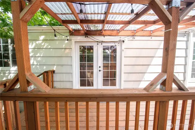 French doors open out to a covered portion of the deck.