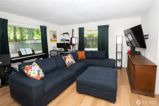 Spacious living area with large picture windows.