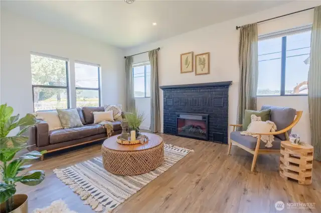 The living room is open to the main living area and is bright and airy