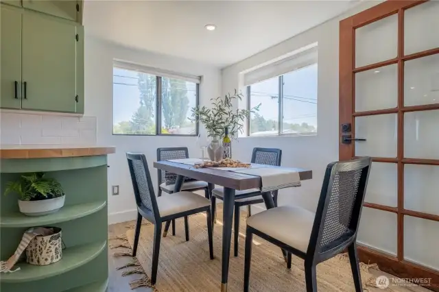 The kitchen also has a bright and cheerful eating space