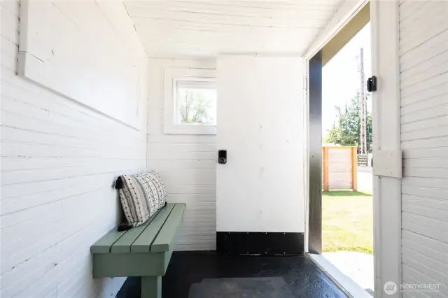 View of the side door and mudroom area