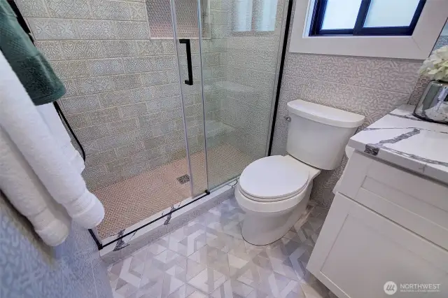 Main floor guest bath with designer finishes