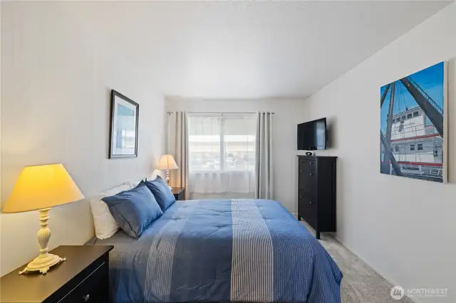 The Bed is a Queen size for scale.  Plenty of room for end tables a desk and more.