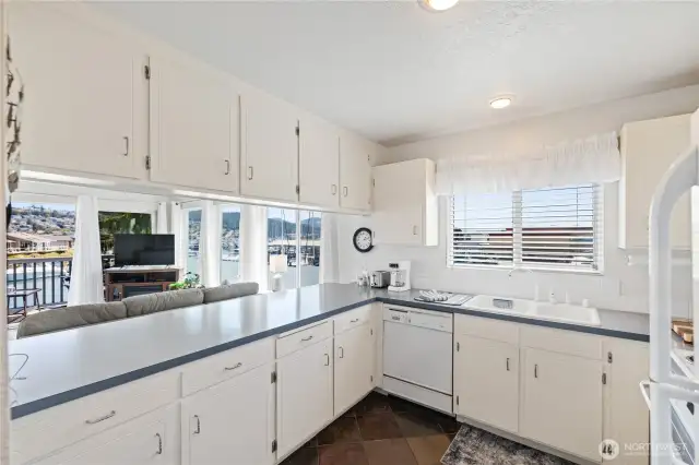 Look at the water views from the Kitchen.  Slate flooring and lots of storage in the kitchen area.