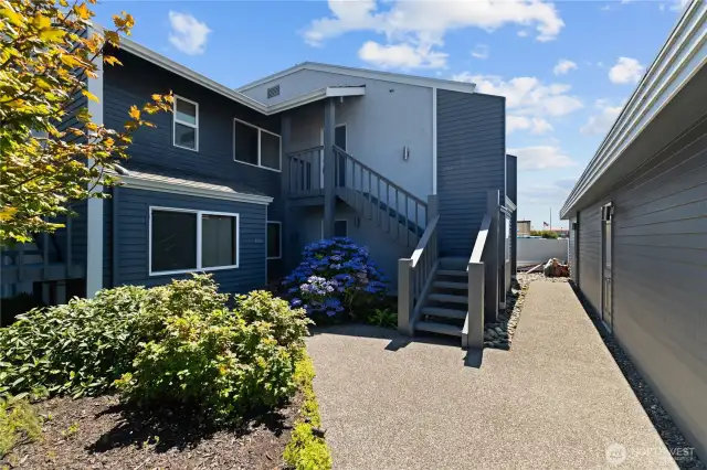 The Stairs and stairway is brand new, replaced and painted.  The door on the right at the end is the convenient garage.  Top floor, end unit.