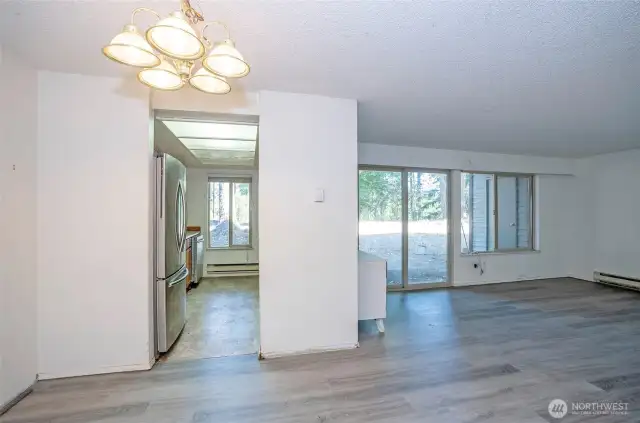 Spacious view from the dining area overlooking both the living room and kitchen, creating an open and connected feel.