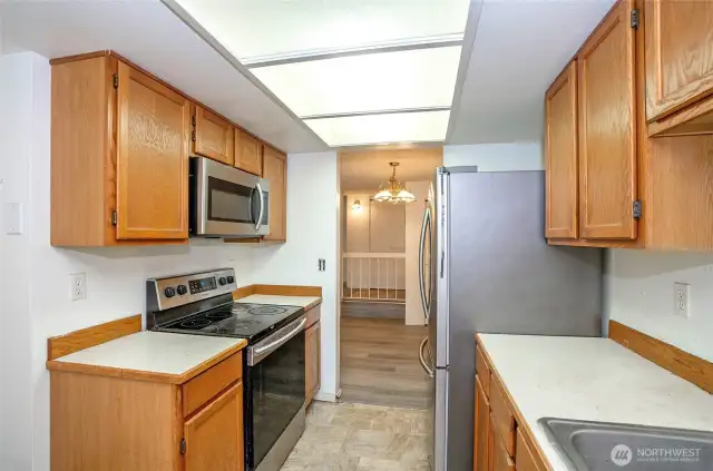 Kitchen located just off the dining area for convenient meal prep and serving.