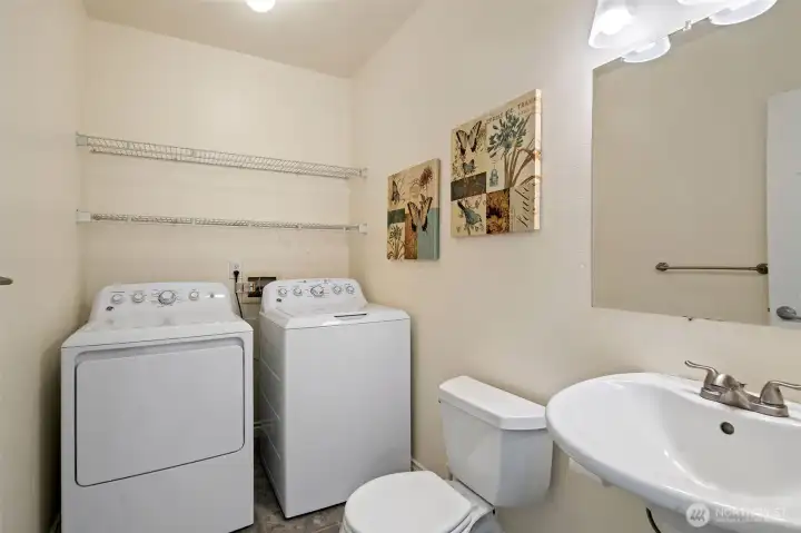 Main floor utility room. Washer and Dryer stays.