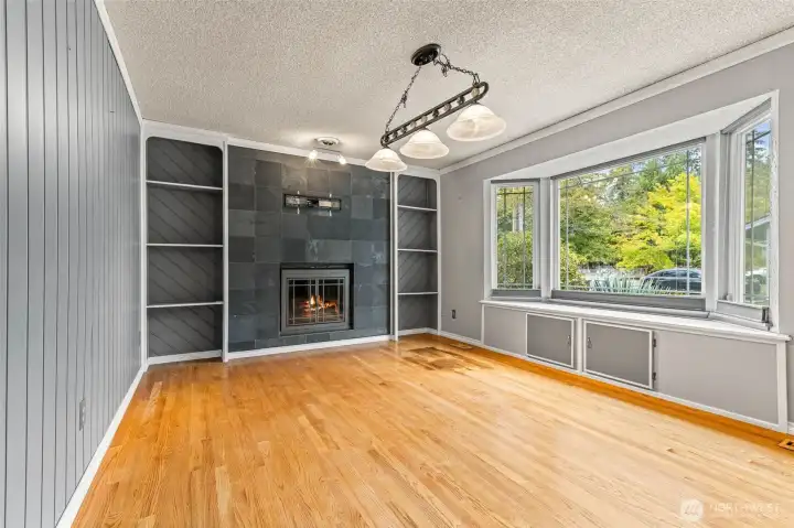 Front Living Room with fireplace and storage in window seat