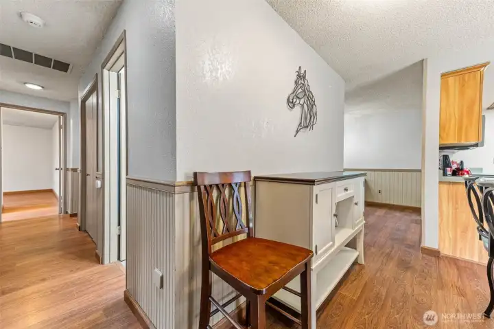 Eating nook looking to dining room on right and down hallway on the left