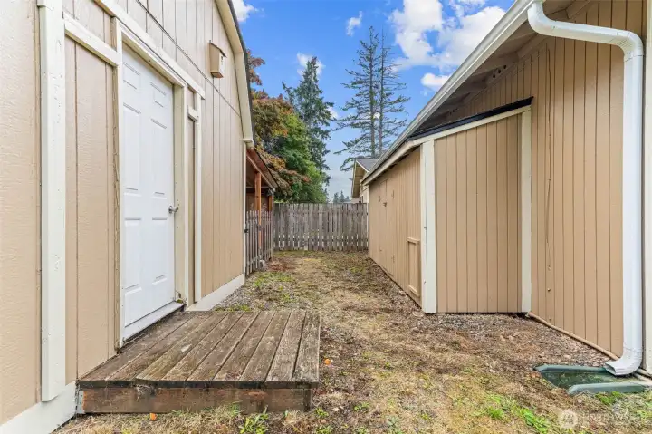 Large shed/shop on the left and storage shed on right