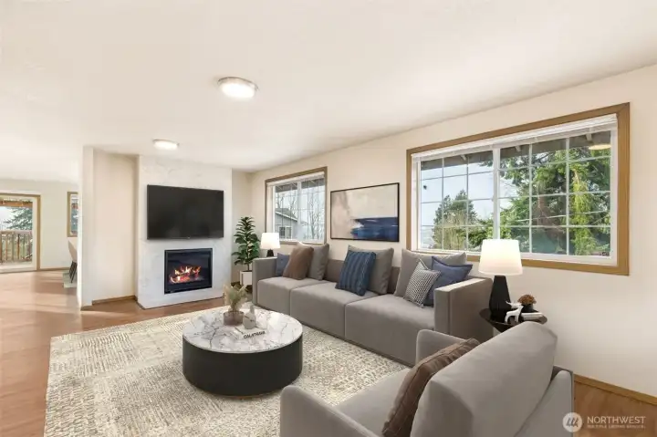 Just off the entry is a nice large family room with updated gas fireplace- vinyl windows allow natural lighting to come through.