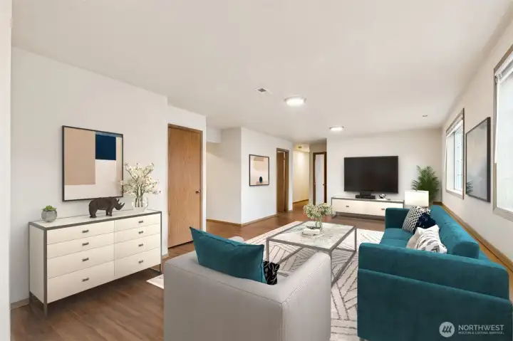 Nice lower level bonus room with plenty of options for seating- could also be a play area for kids, workout room, hobby area?