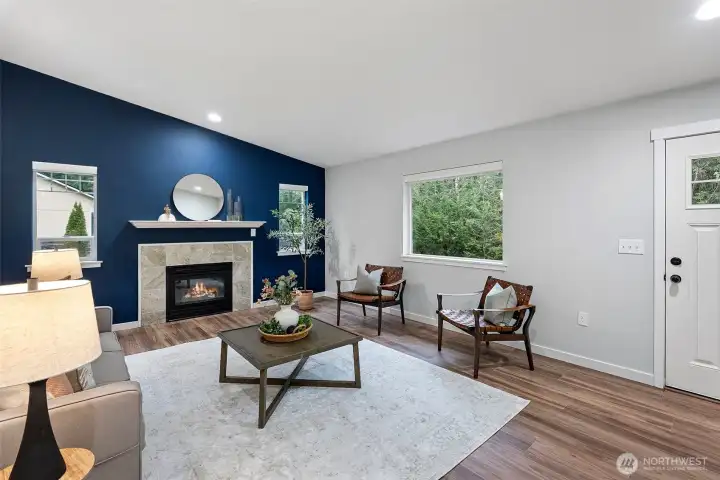 Walk in to living area with a cozy propane gas fireplace