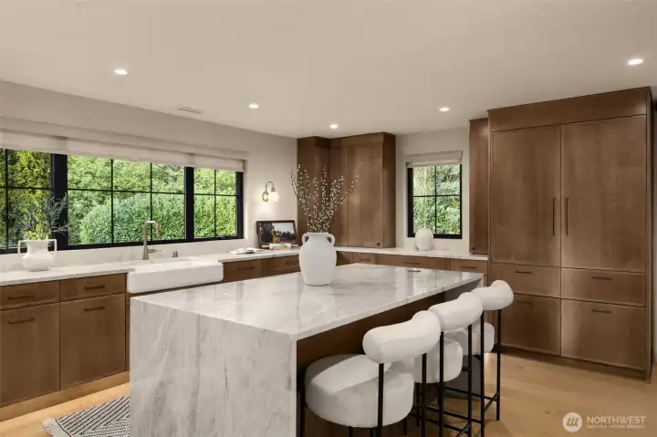 Gourmet kitchen with oversized waterfall island