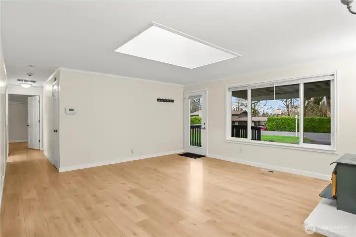 Un-stagged living room with view of the front/street