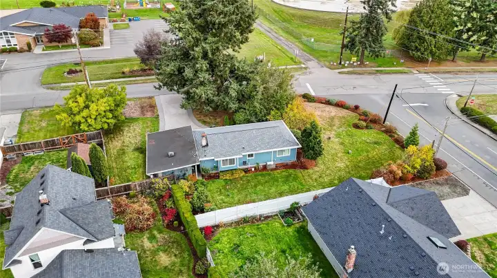 New Roof in 2024~Partially Fenced Corner Lot~Mature Fir Trees & well Established Landscaping