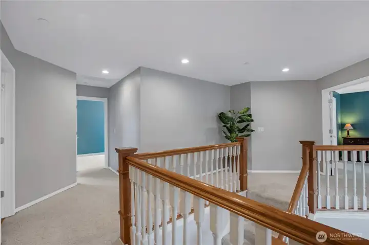 upstairs to all bedrooms, right door leads to the primary suite