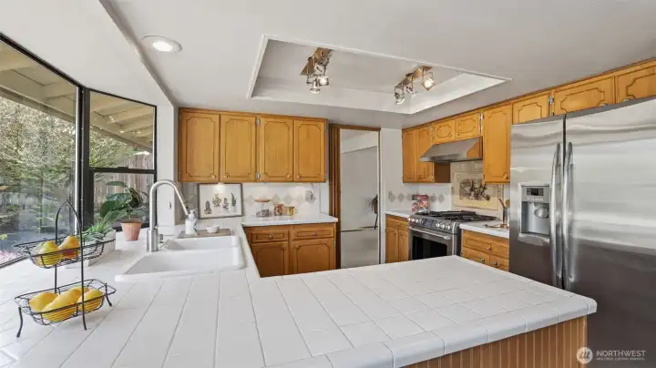 Full size kitchen with stainless steel appliances.