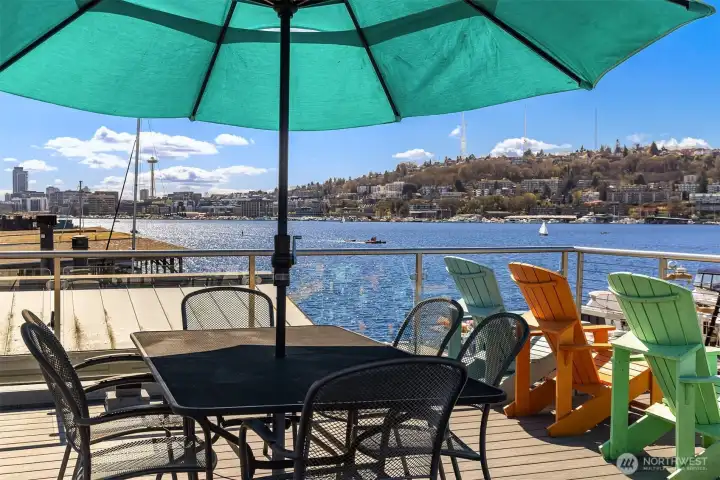 Looking south from the roof: the Space Needle, the Queen Anne skyline, and the south end of Lake Union in one frame.