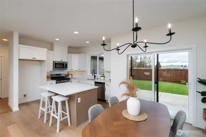 Kitchen and dining area - Pics are of a different 1663 plan. Features and colors may differ.