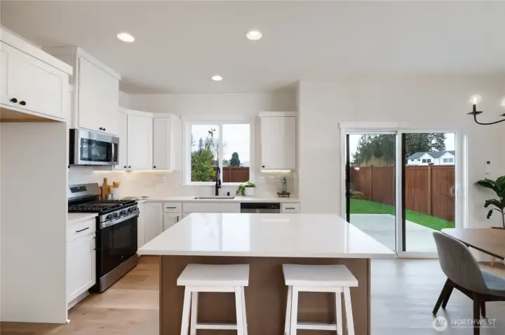 Kitchen and dining area - Pics are of a different 1663 plan. Features and colors may differ.