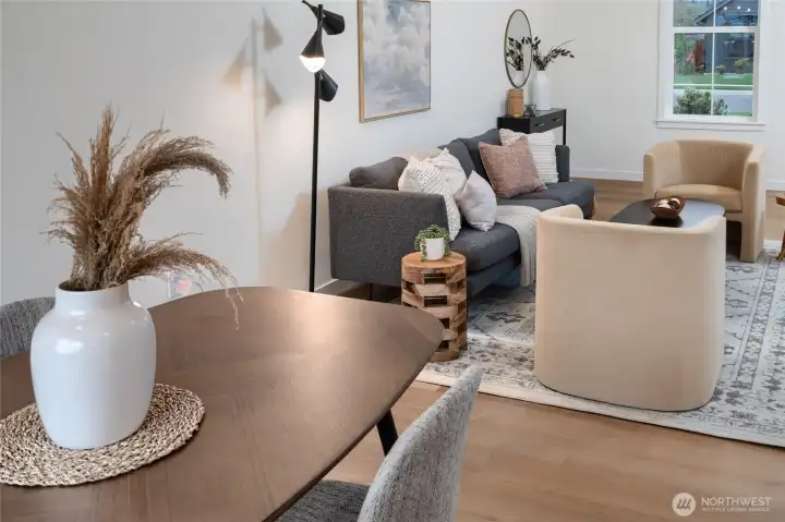 Dining and Living Area - Pics are of a different 1663 plan. Features and colors may differ.