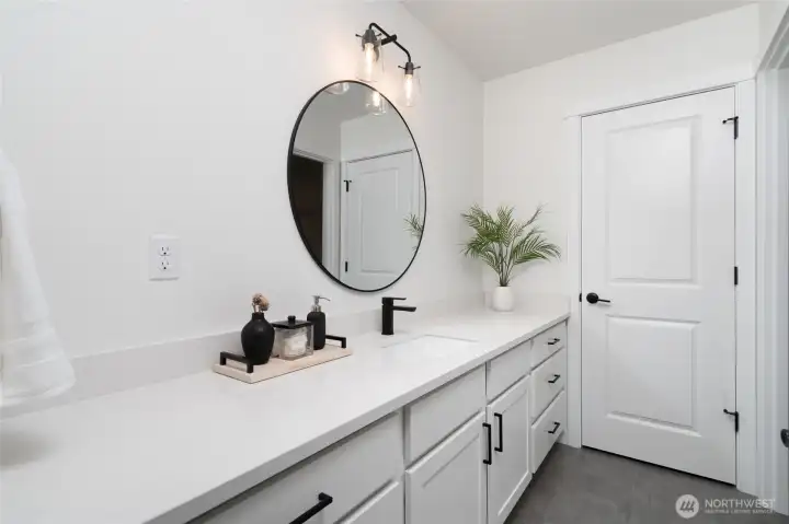 Upstairs primary bathroom - Pics are of a different 1663 plan. Features and colors may differ.