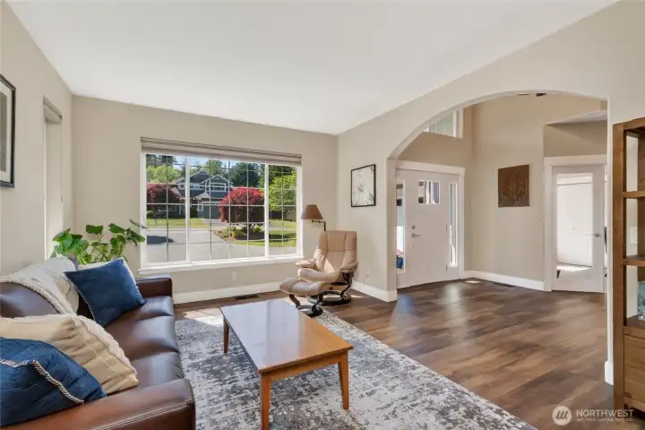 Living room is spacious with tons of windows bringing in the natural light.