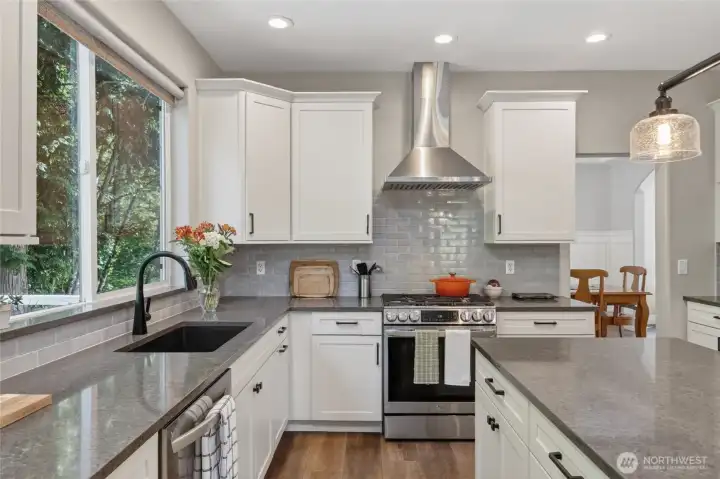 Quartz counter tops, deep sink, stainless appliances and island great for workspace and entertaining.