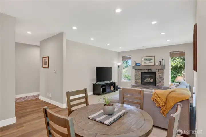 Family room off kitchen/dining nook.  Hall leads to powder bath, utility room and garage to right and entry/office to left.