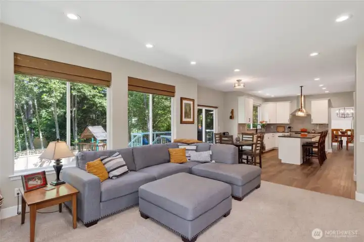 wall of windows brings the light and lovely view of forest lot next door. Beautiful setting.